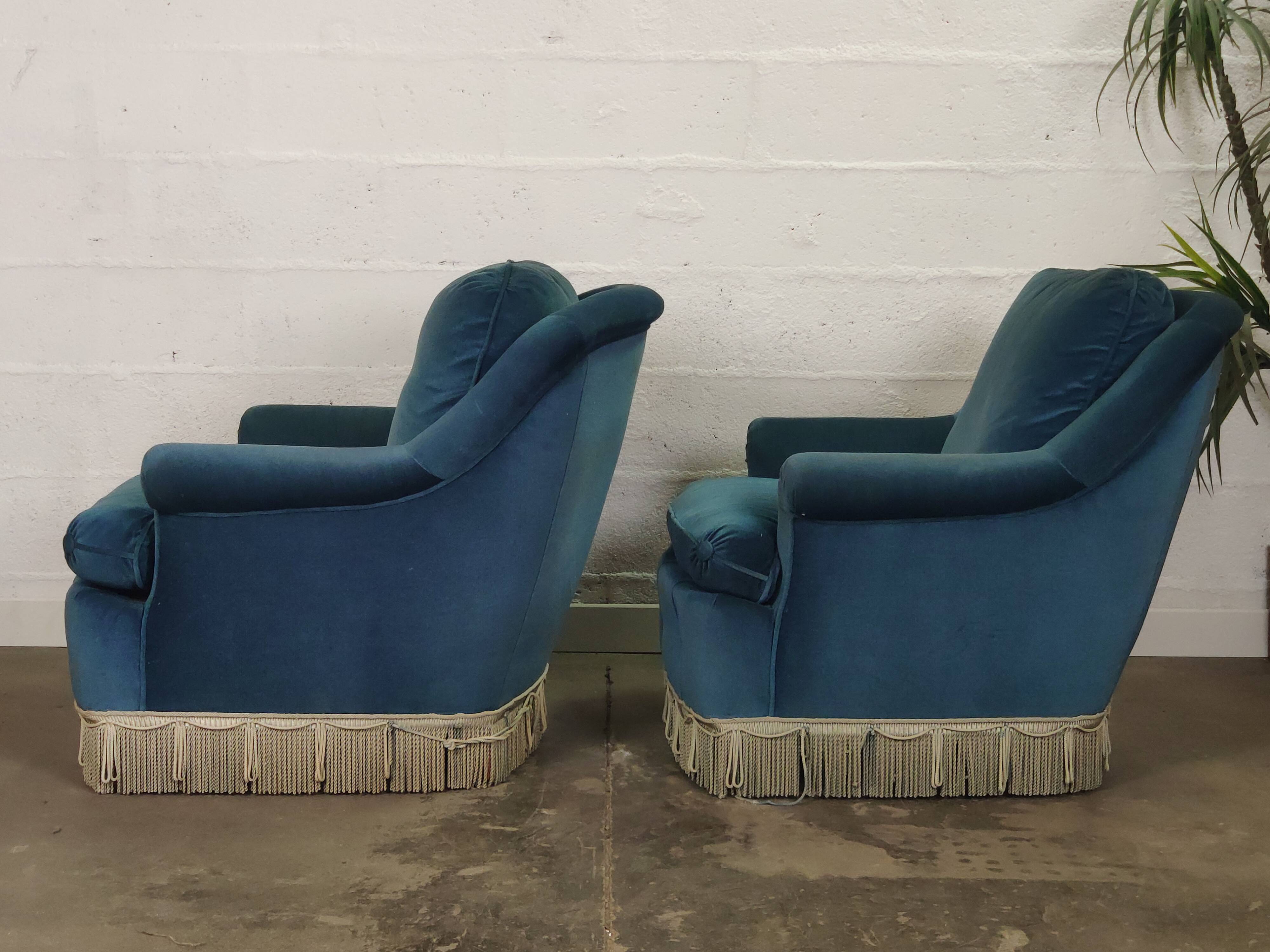 Pair of blue velvet armchairs with fringes