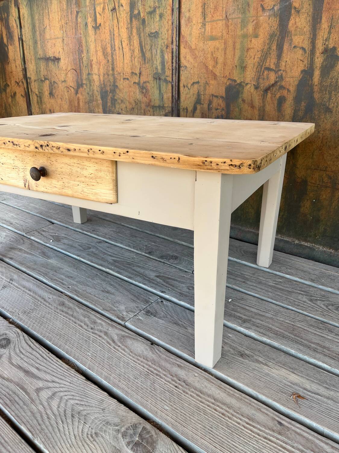 Raw wood and taupe coffee table