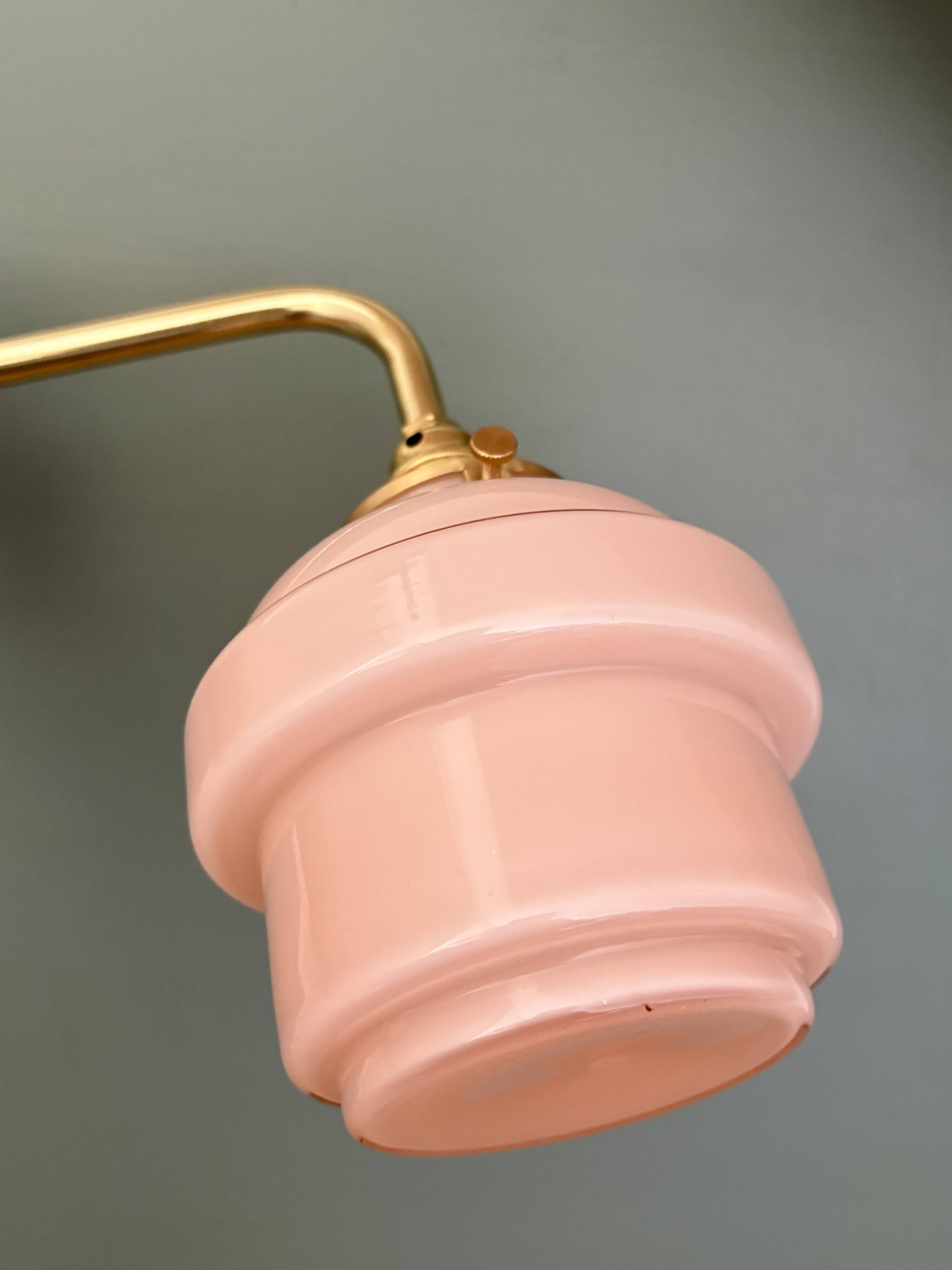 Vintage pink opaline globe wall light.