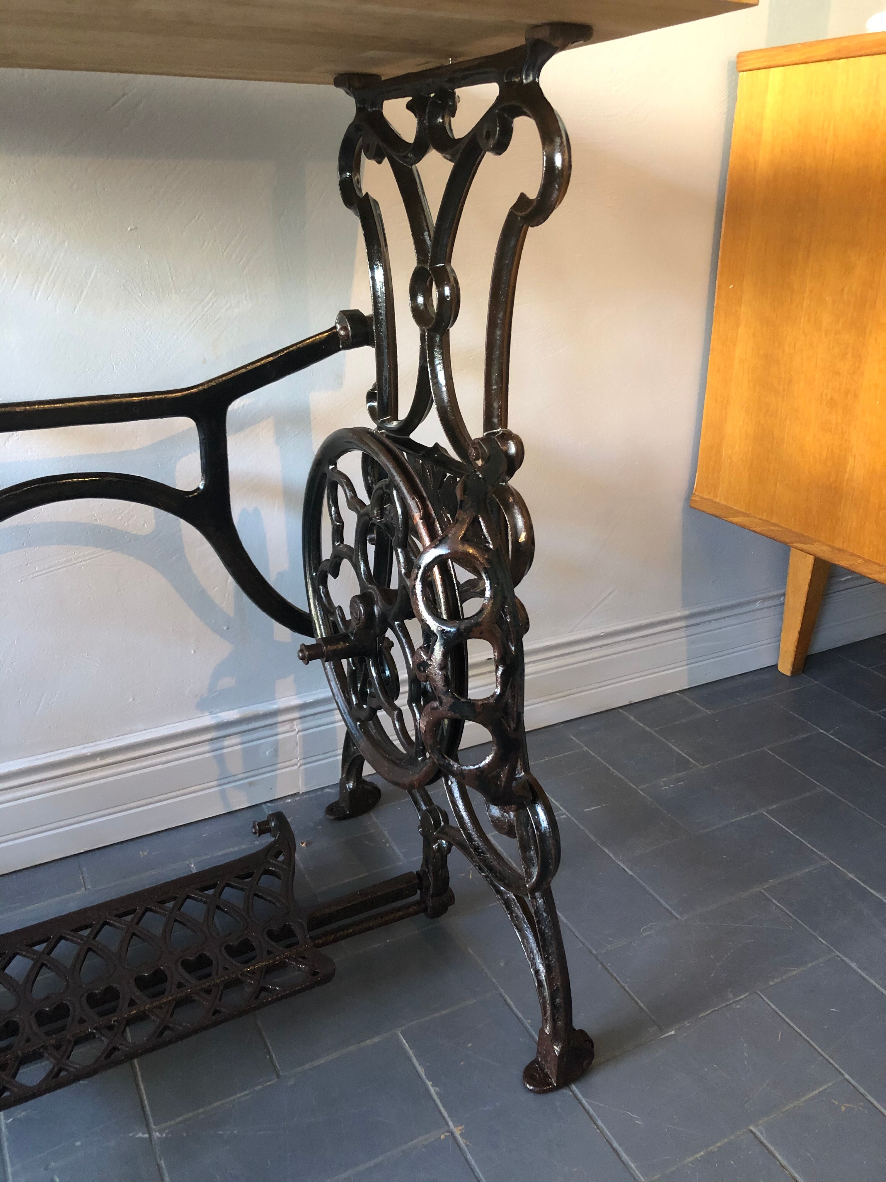 Ancient table, cast iron footing