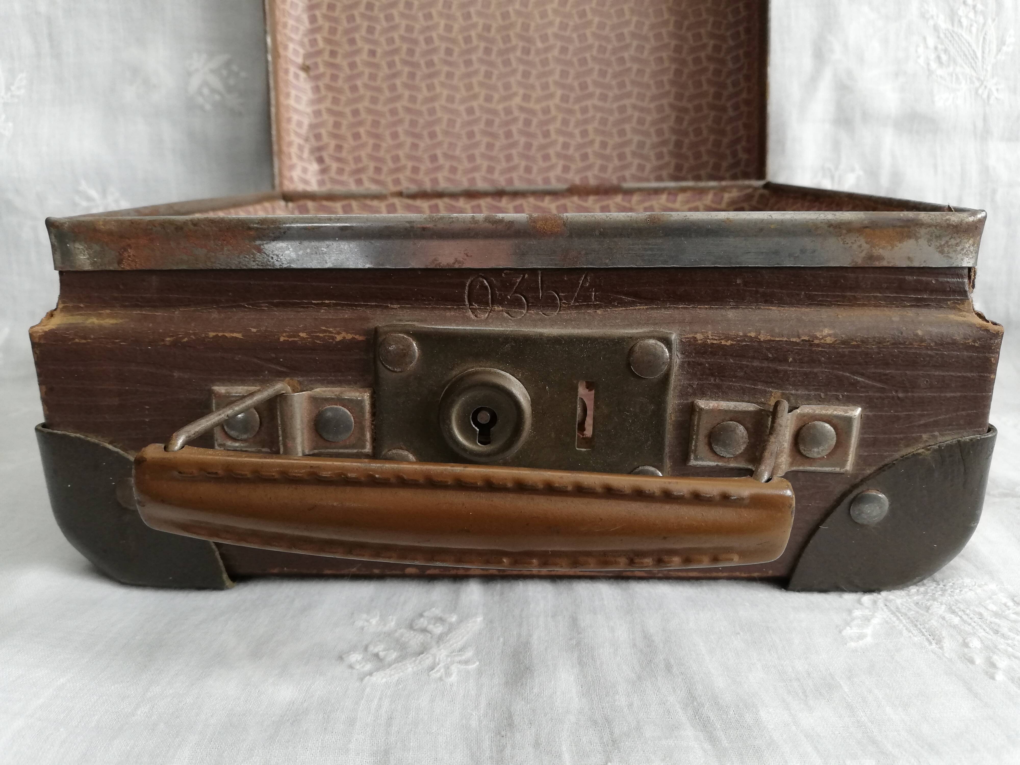 Old metal cardboard suitcase