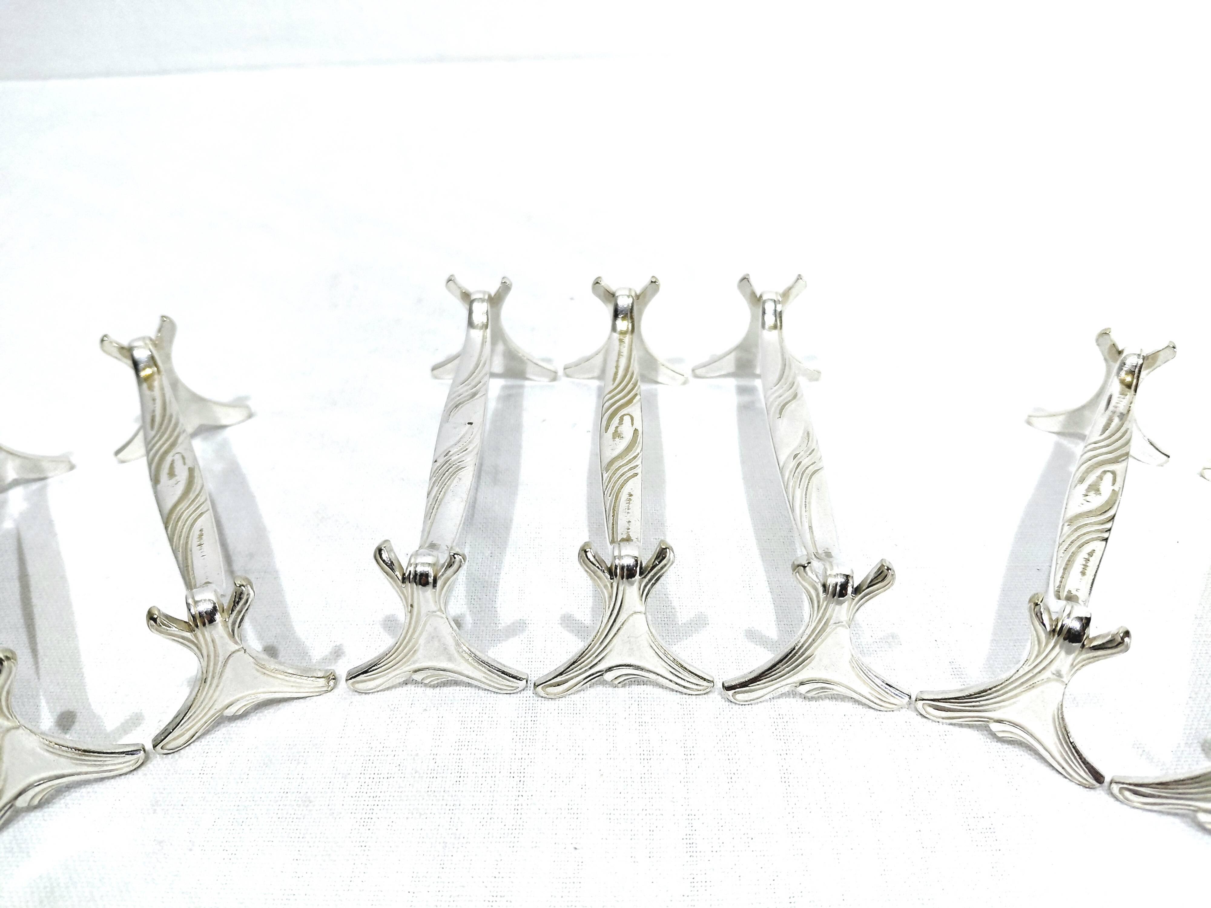 CHRISTOFLE - SET OF 11 SILVER-PLATED KNIFE RESTS