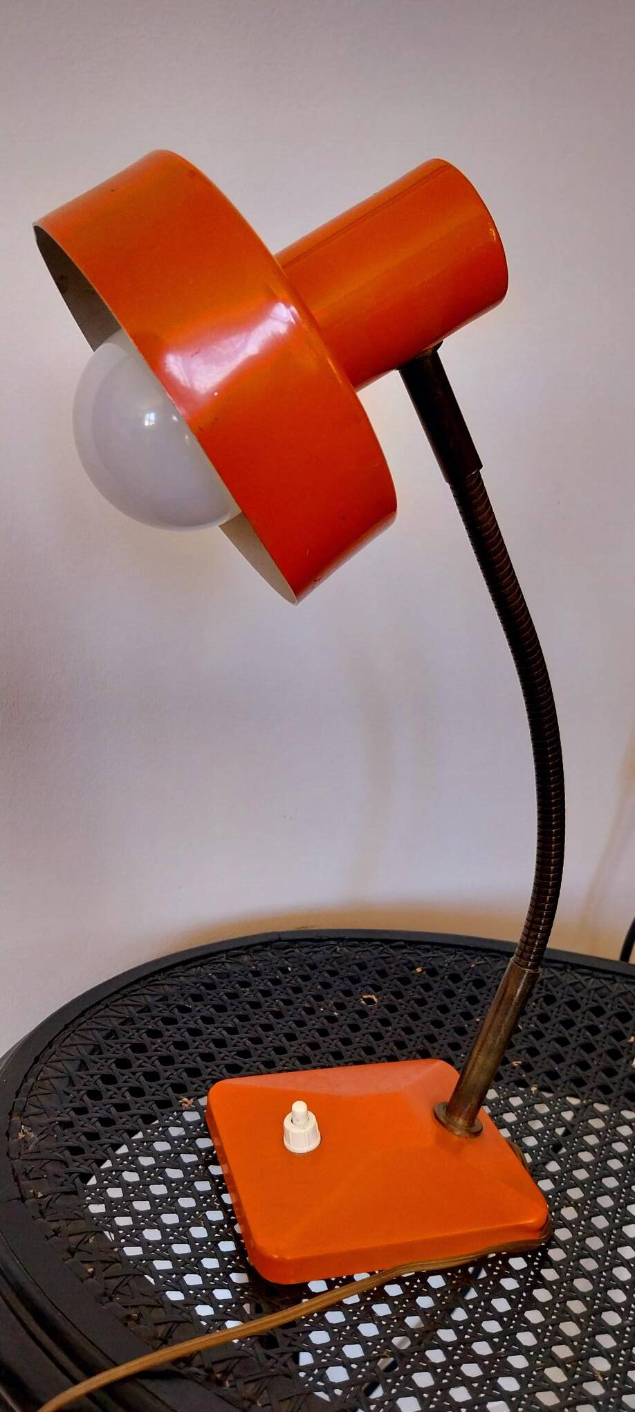 Orange metal lamp from the 60s and 70s.