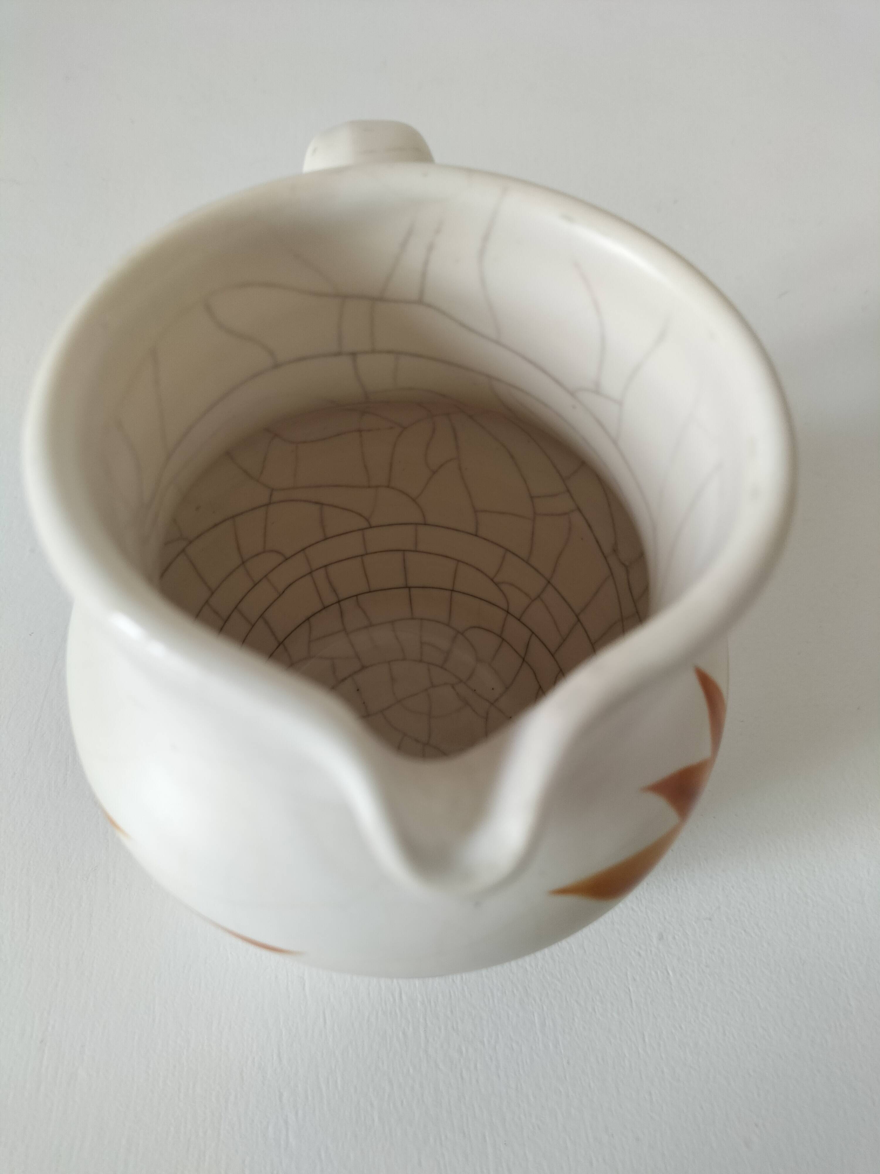 Vintage Marais pottery pitcher with orange floral decoration