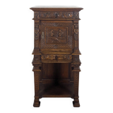 Renaissance-style cabinet in solid oak decorated with chimeras and caryatids