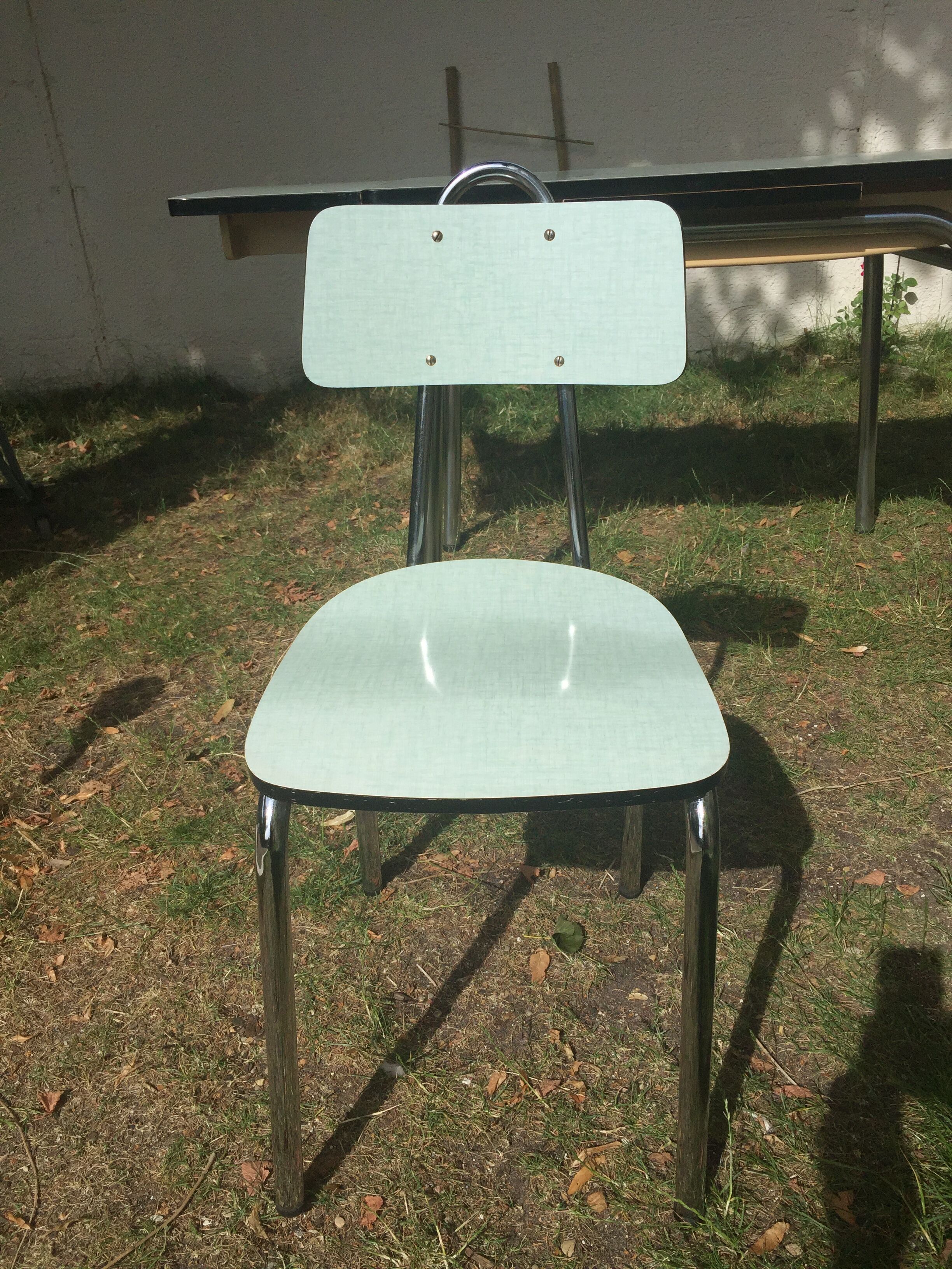 Table and 4 green water formica chairs 60's