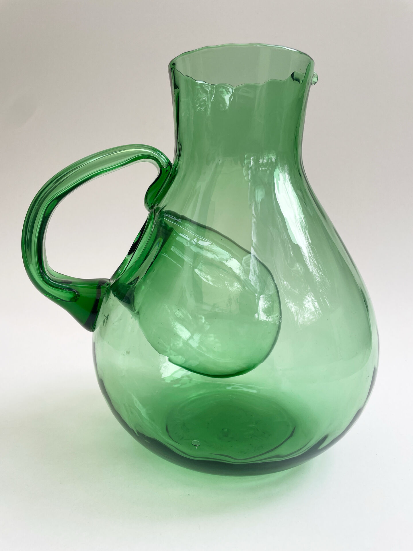 Large green glass cooling jug