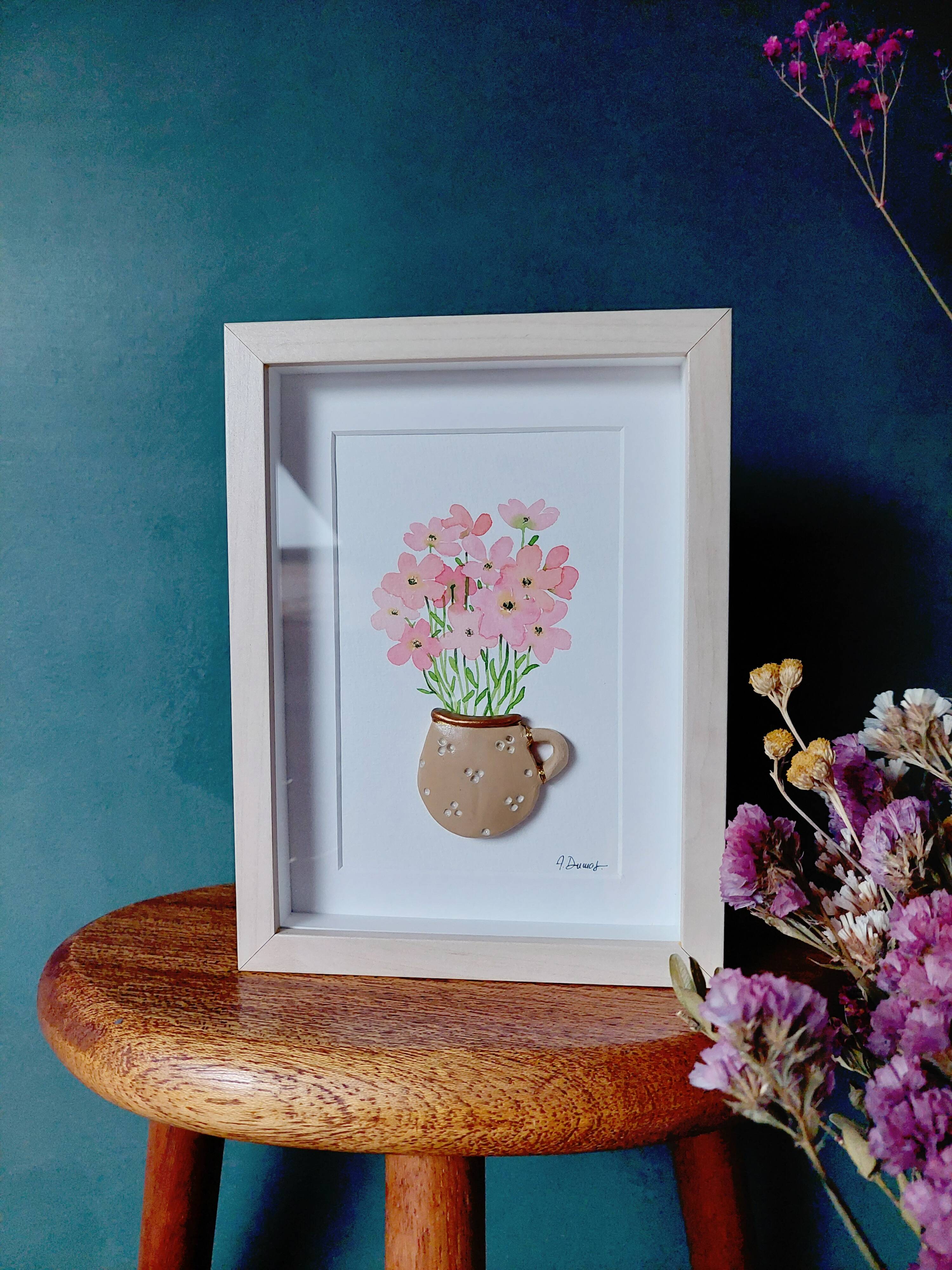 Relief painting bouquet of pink flowers in watercolor in a handmade clay mug