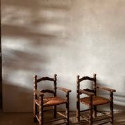 Pair of French spindle chairs in the style of Charles Dudouyt.