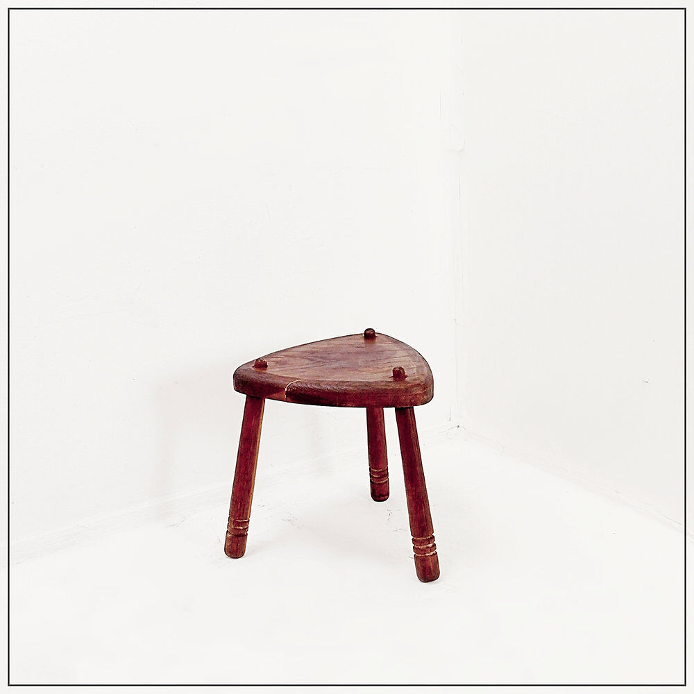 Rustic tripod stool with a triangular seat, 1960s.