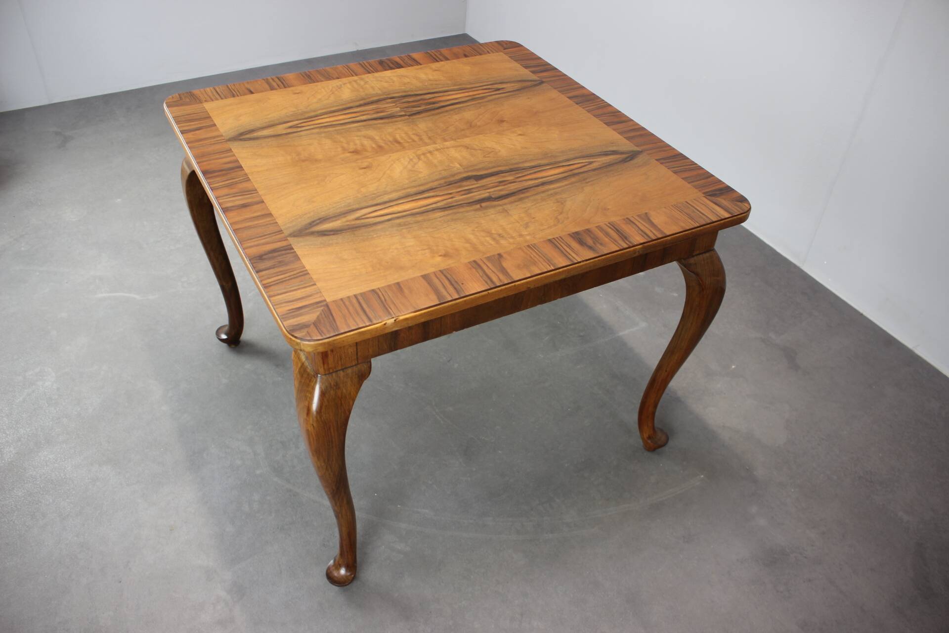 European Art Deco square coffee table from the 1930s in walnut veneer with a restored oiled finish
