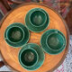 Set of 4 green ceramic coffee cups and plates