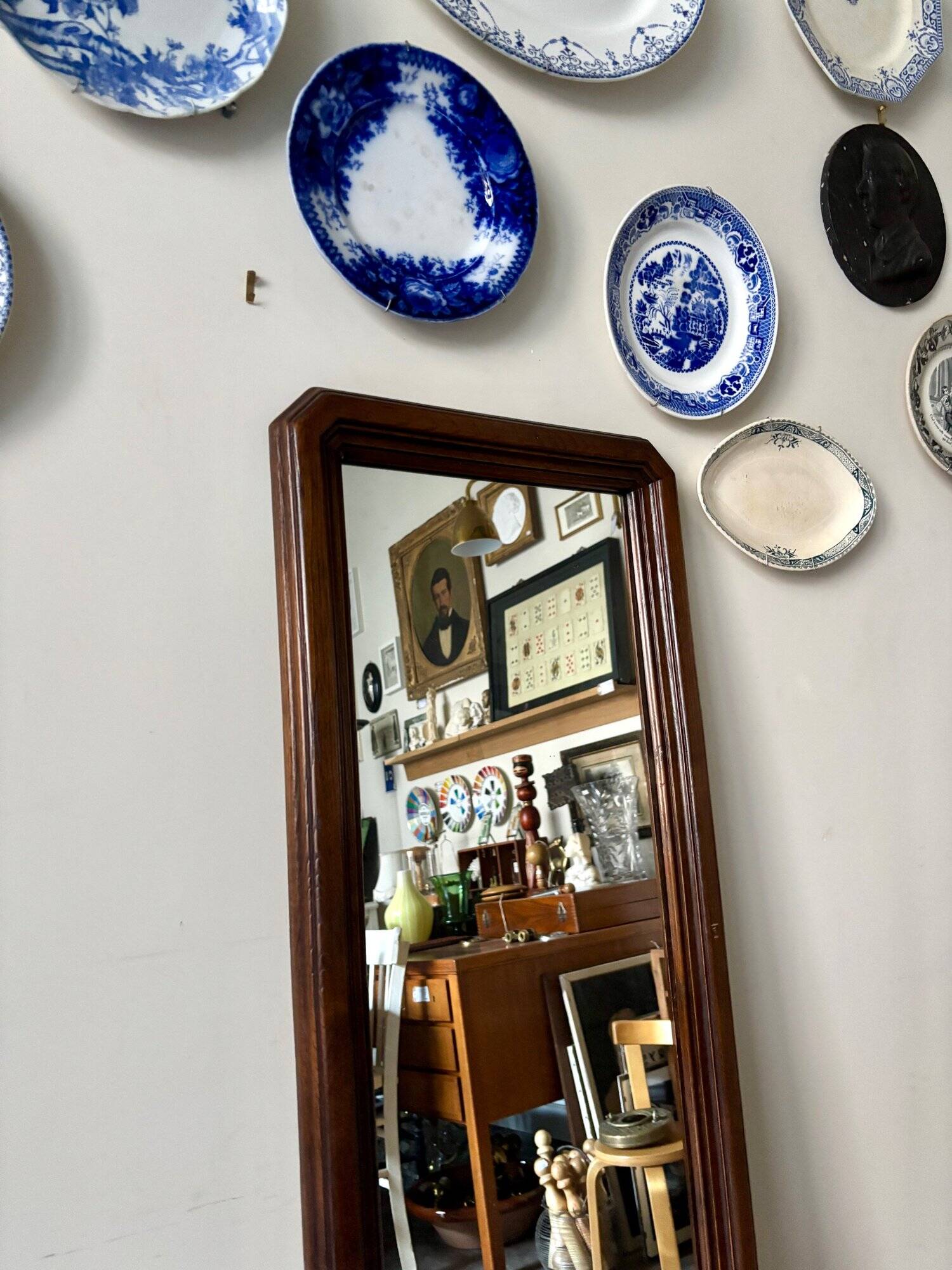 Full-length rectangular mirror in dark wood