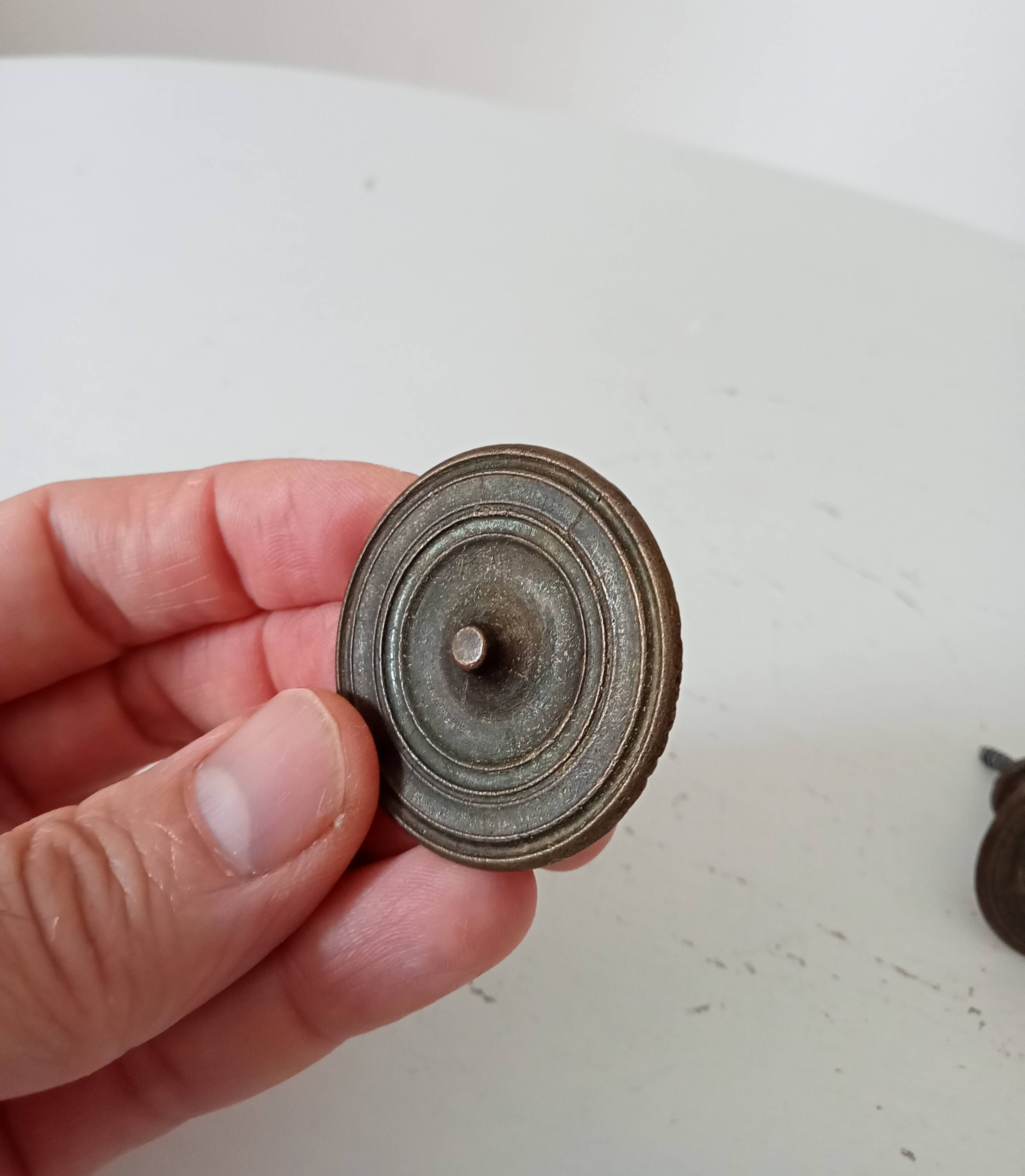 Pair of antique Empire furniture knobs from the 19th century.