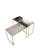 Set of 2 vintage nesting coffee tables in chrome metal and smoked glass.