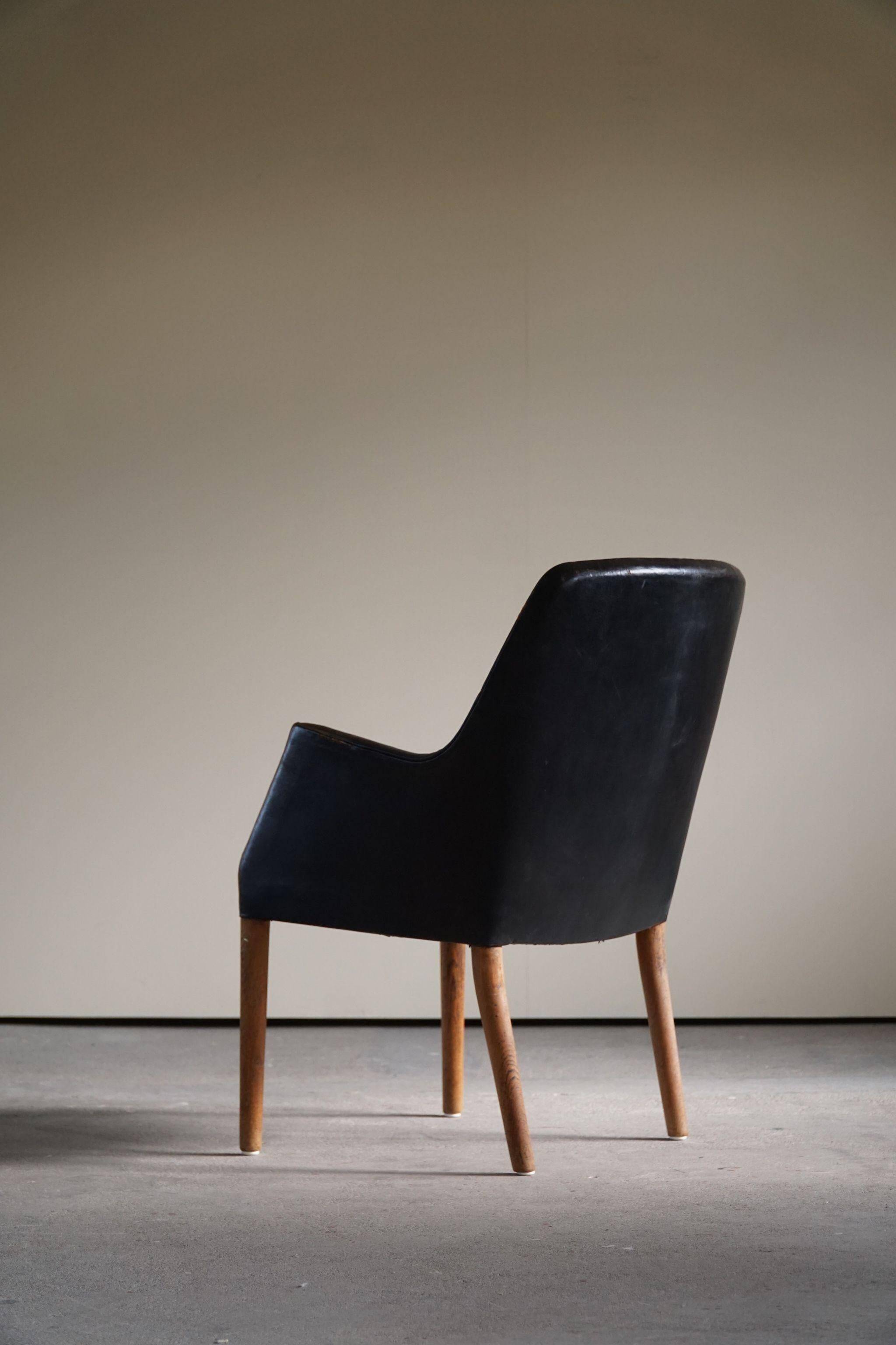 Fauteuil Danemark Moderne par Nanna Ditzel en chêne et cuir patiné, années 1950
