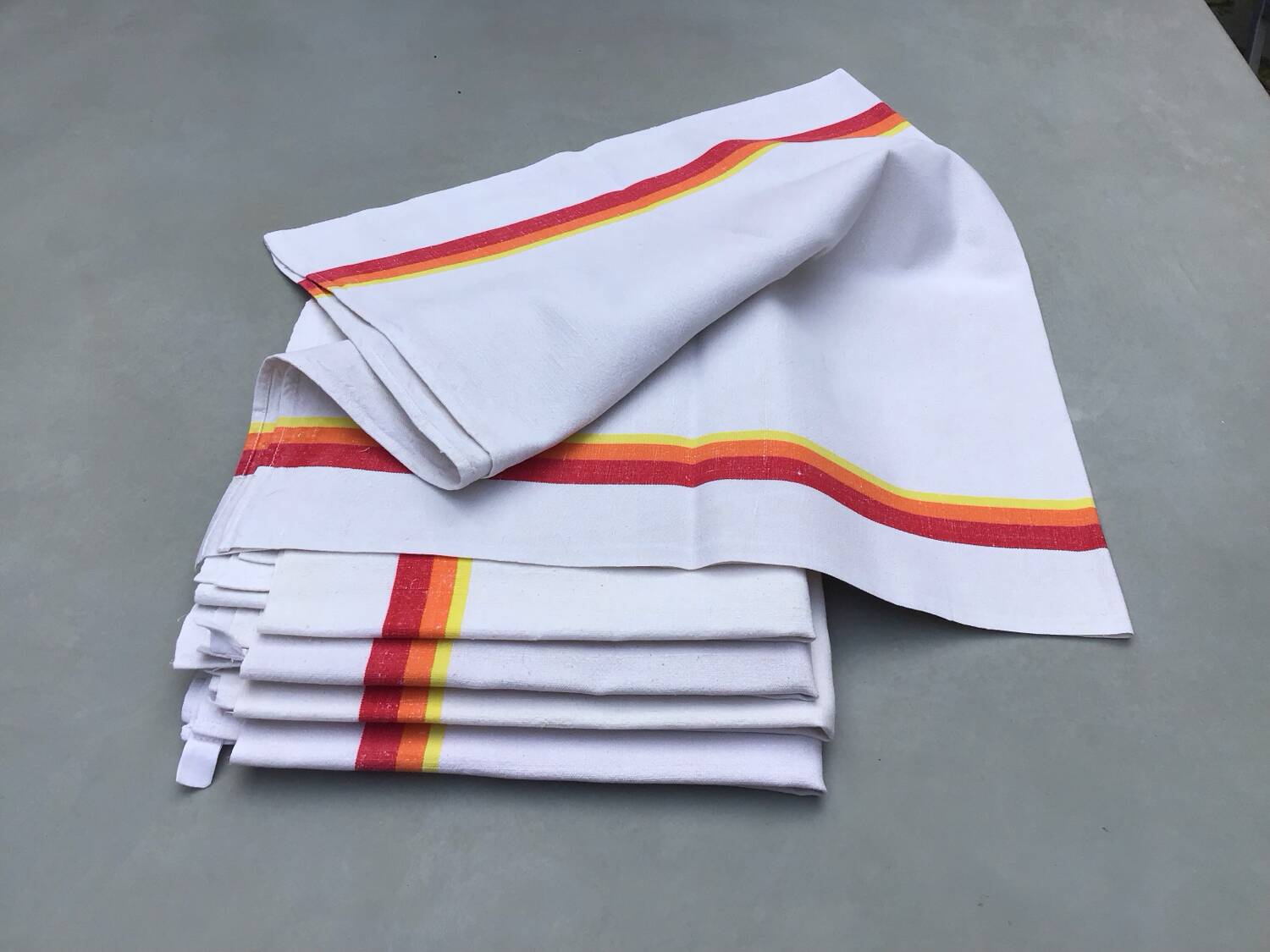 5 old tea towels in ecru linen with orange, red and yellow stripes