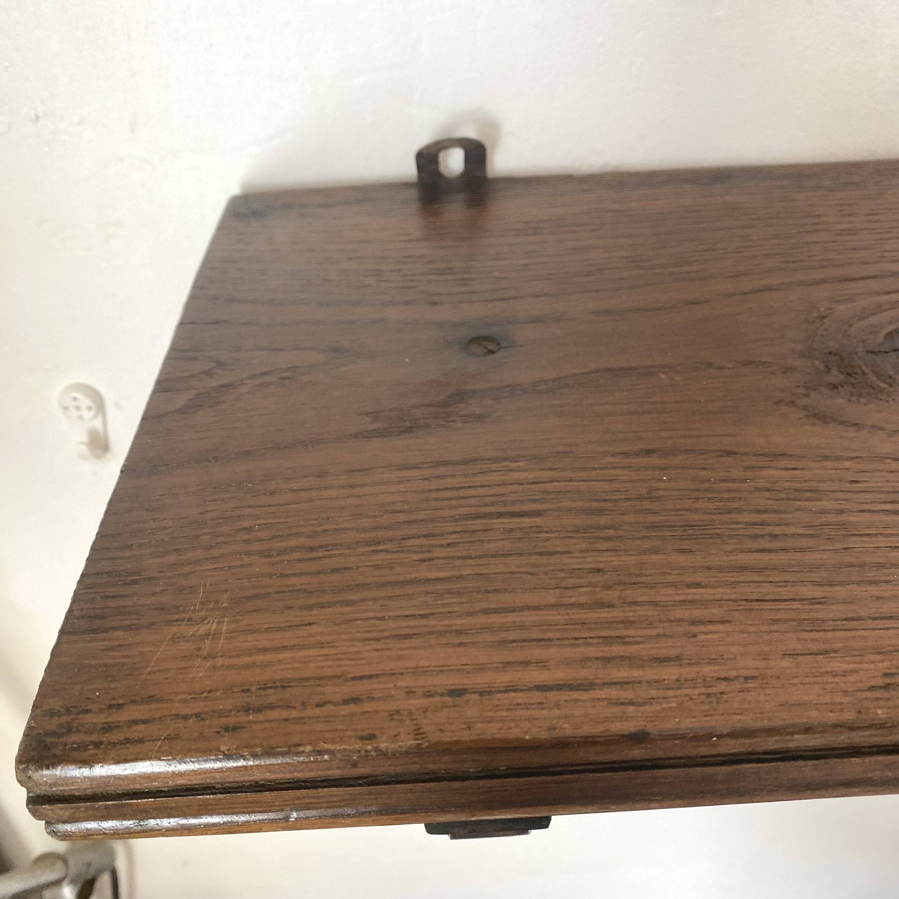 antique oak wall shelf with carved brackets