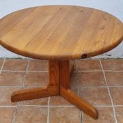 Scandinavian coffee table in solid pine with tripod legs in Swedish chalet style.