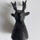 Salt and pepper shaker set with patinated brass deer heads.
