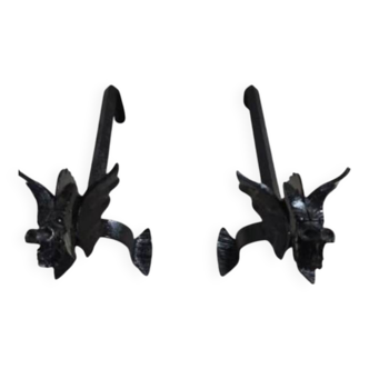 A pair of wrought iron andirons with dragon heads, 1970s.