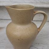 Beige ceramic pitcher