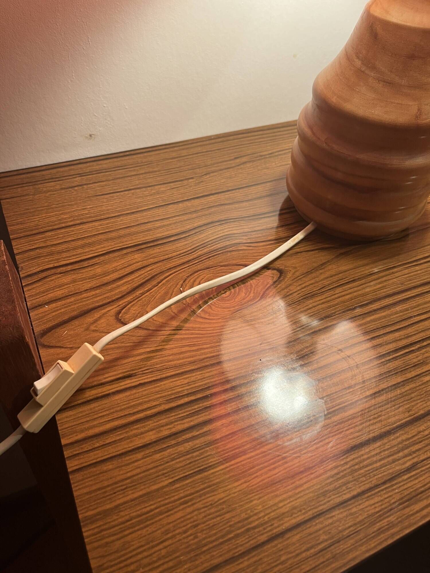 Vintage lamp with a carved wooden base from the 1970s.