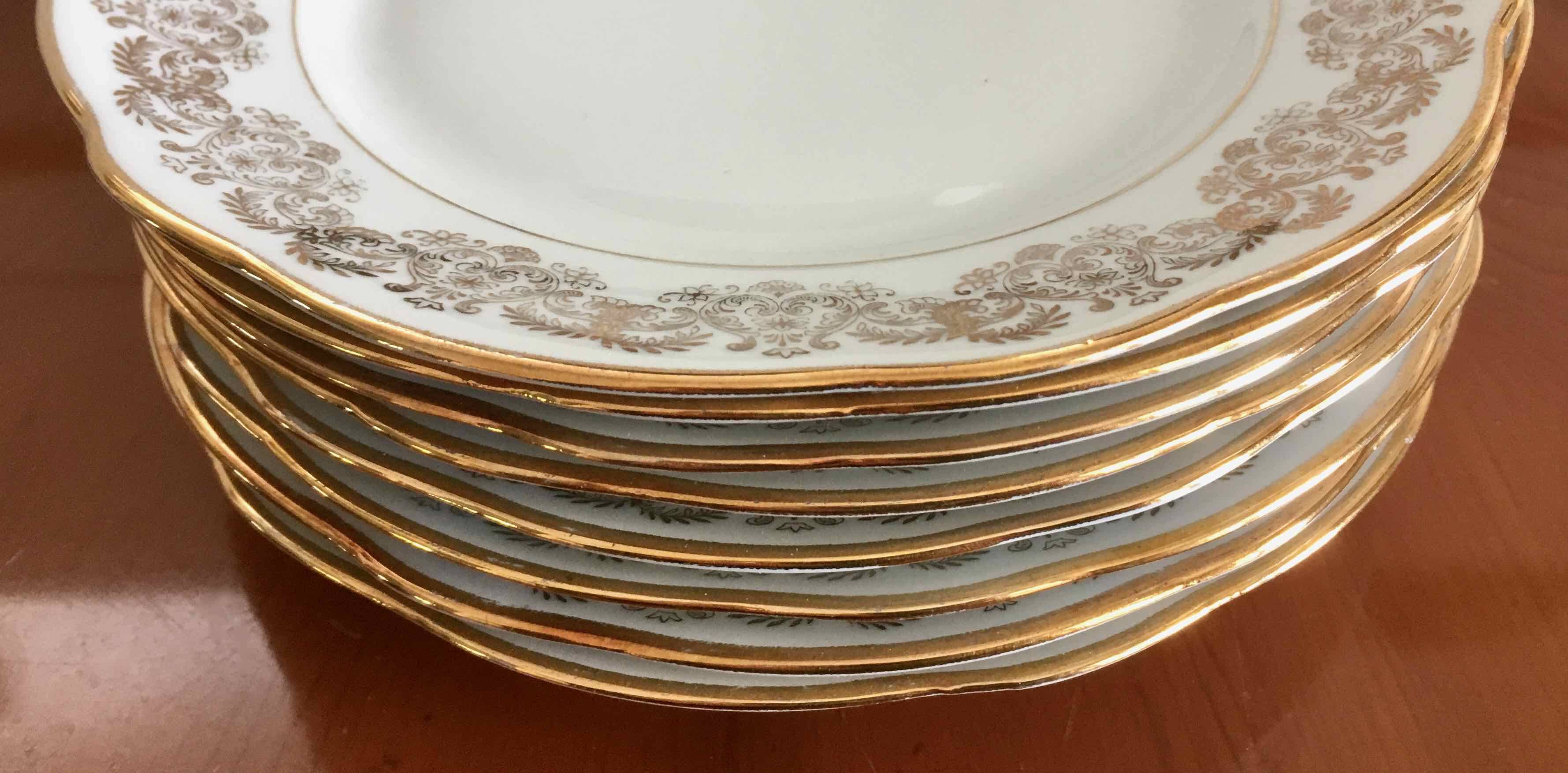 8 white and gold porcelain dessert plates