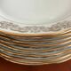 8 white and gold porcelain dessert plates