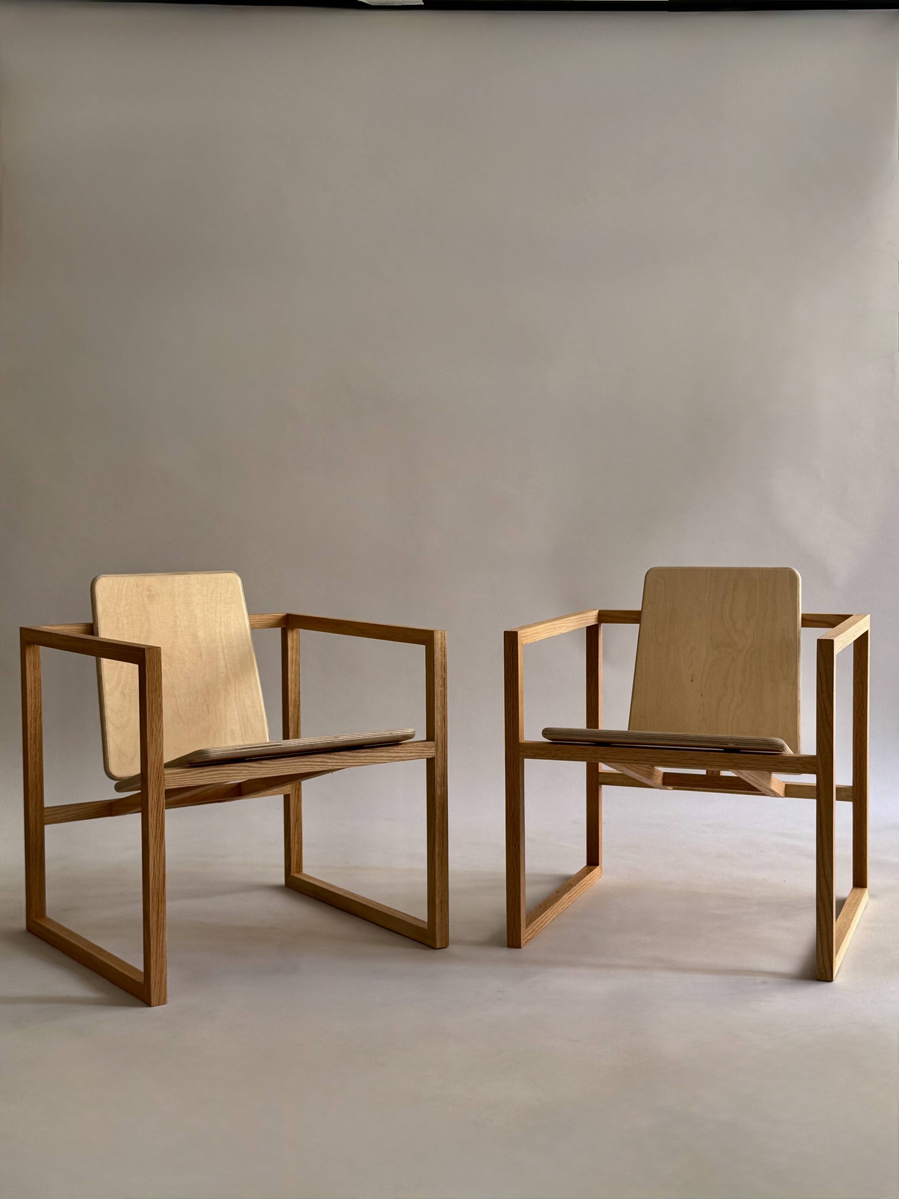 Pair of handmade wooden armchairs