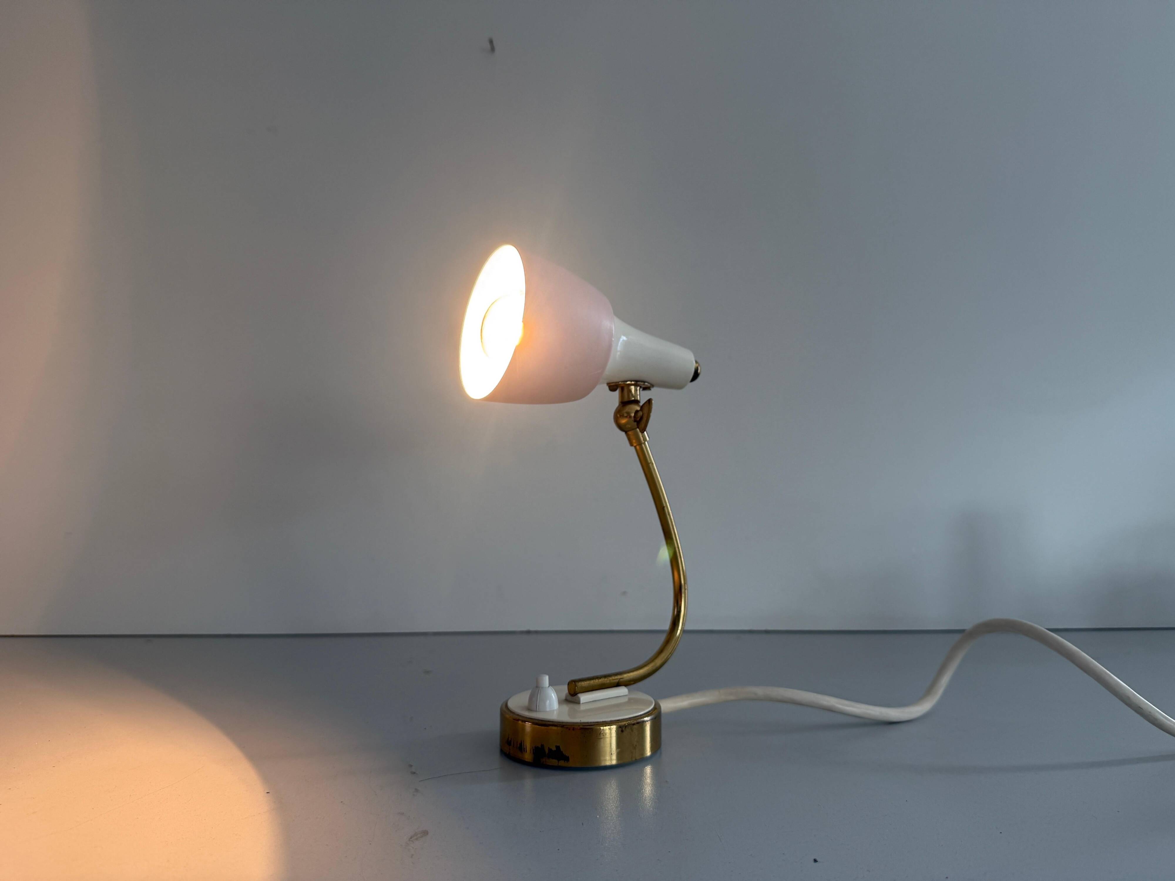 Simple table lamp with a pink metal head and brass body, 1960s, Germany.