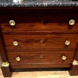 Empire chest of drawers with half columns in mahogany and gilded bronze