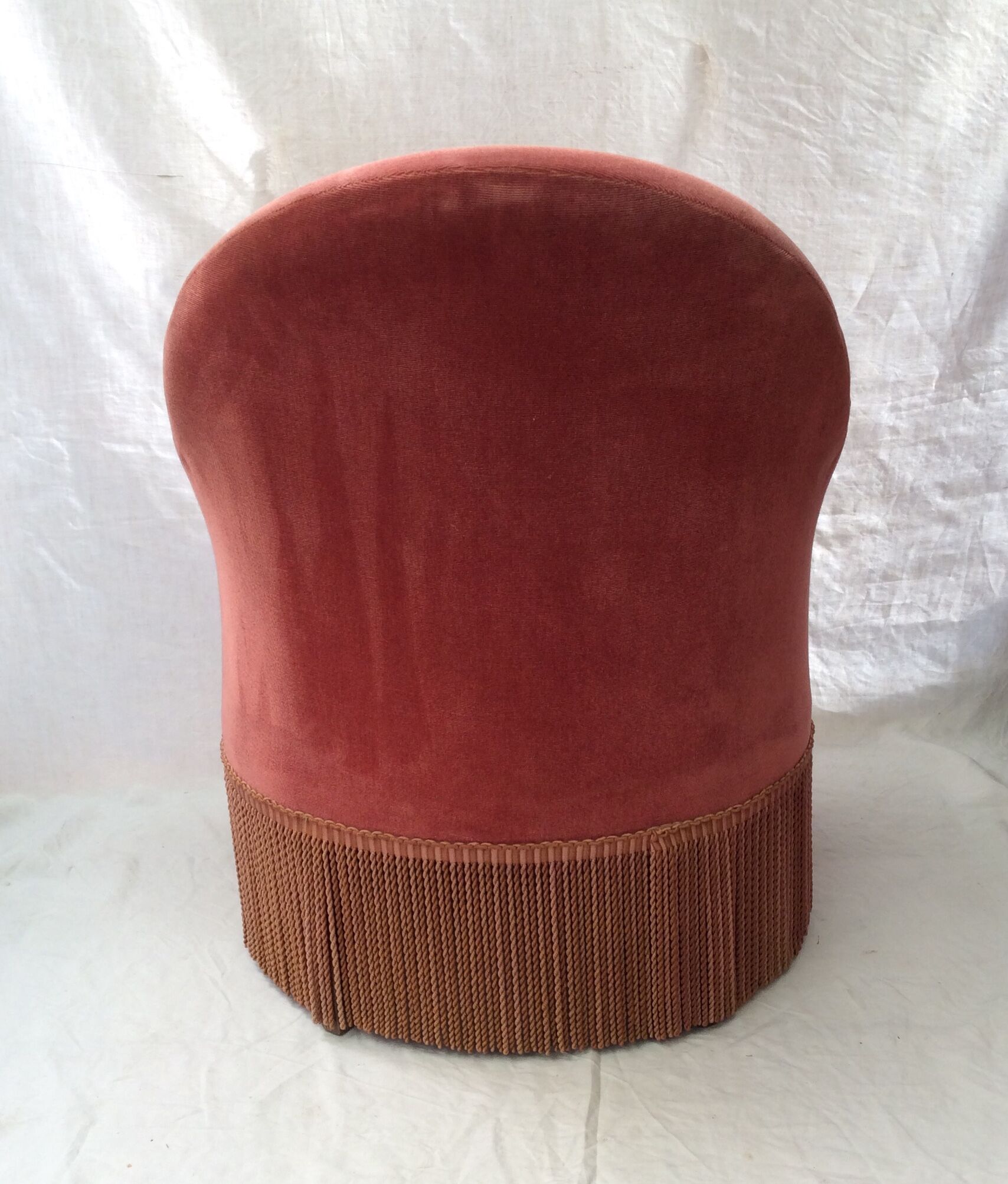 Pink velvet toad chair in the 1960s