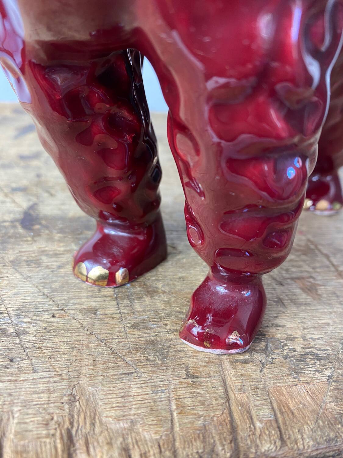 Burgundy and gold ceramic dog