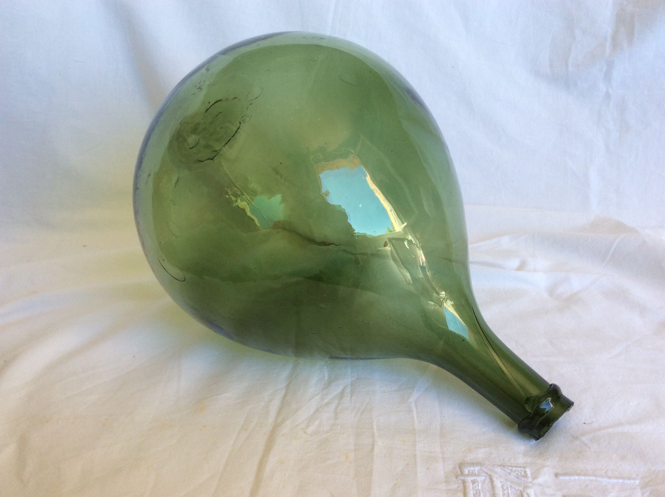 Former "lady jeanne" in blown glass, green bottle