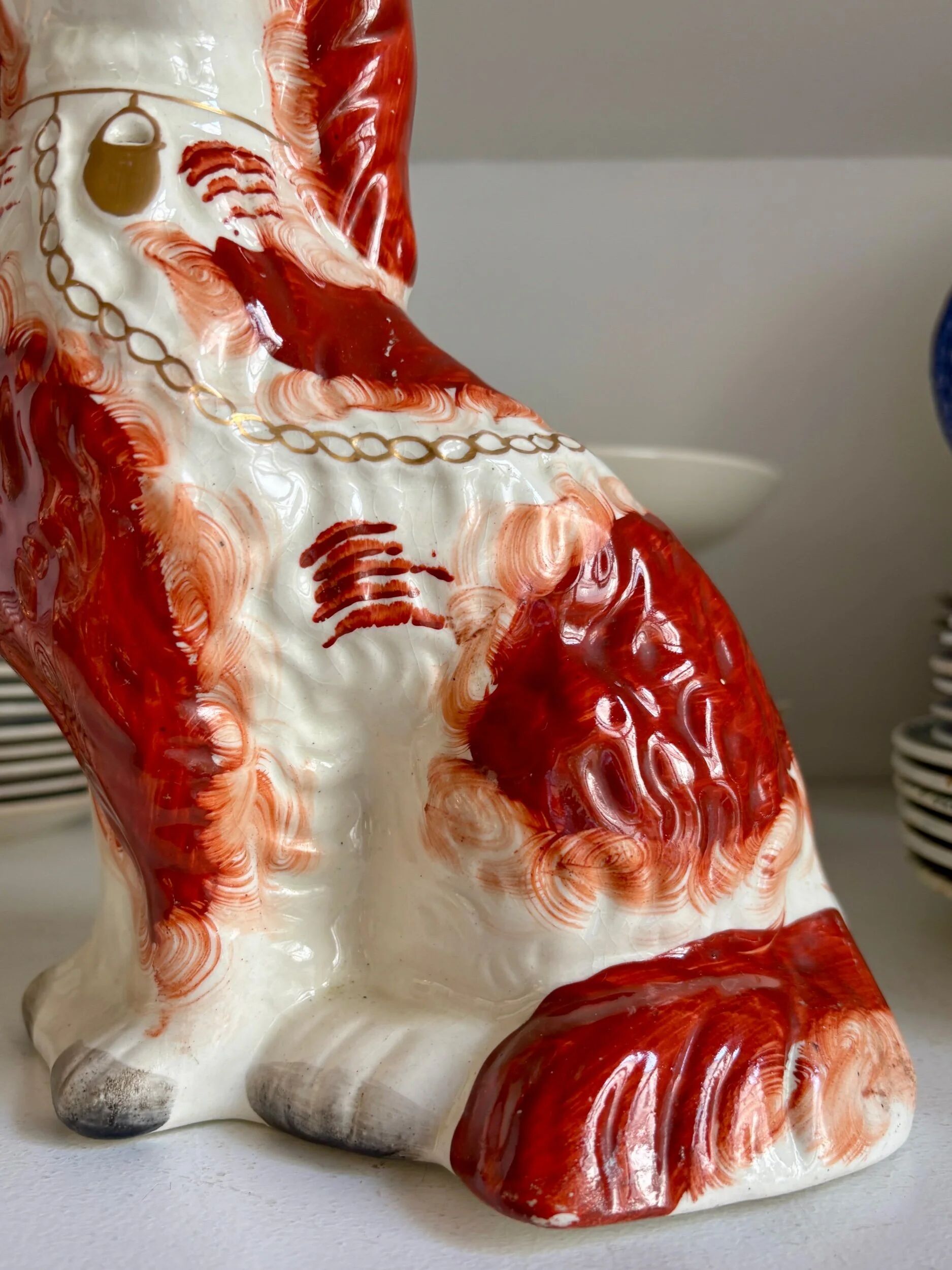 Staffordshire porcelain King Charles Cavalier dog in red, number 1, 19th century.