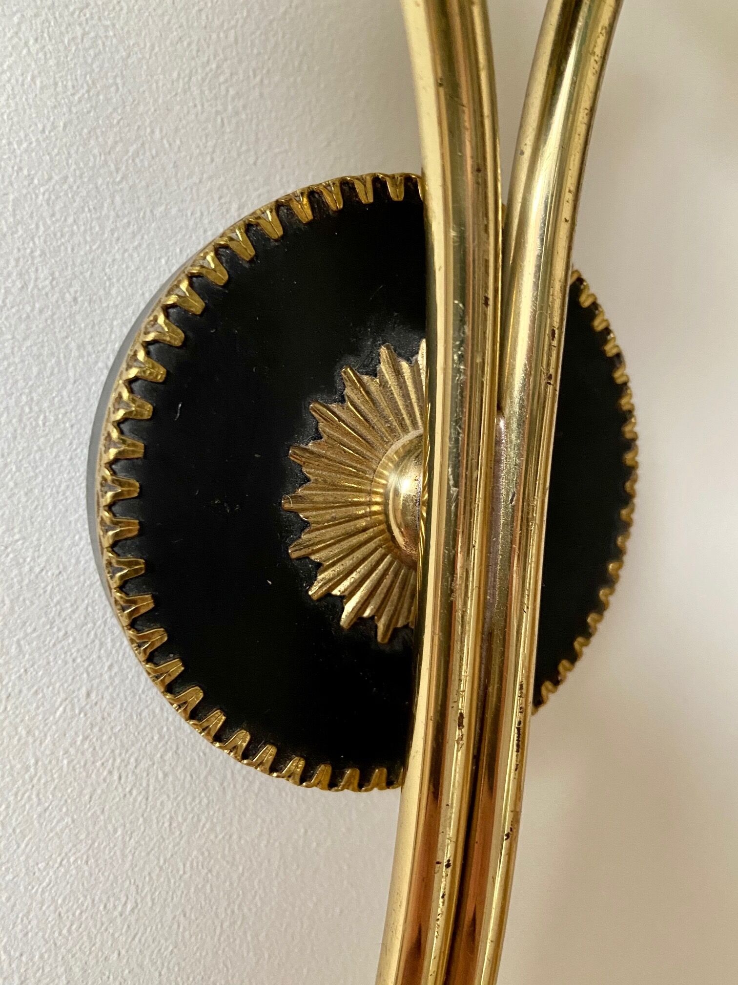 Black and gold metal wall and white opalines sconce