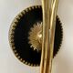 Black and gold metal wall and white opalines sconce