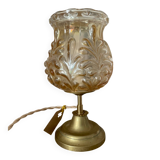Table lamp with amber glass globe and brass base