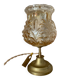 Table lamp with amber glass globe and brass base