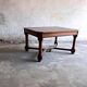 French dining table in Neo-Renaissance style with cross legs.