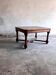French dining table in Neo-Renaissance style with cross legs.