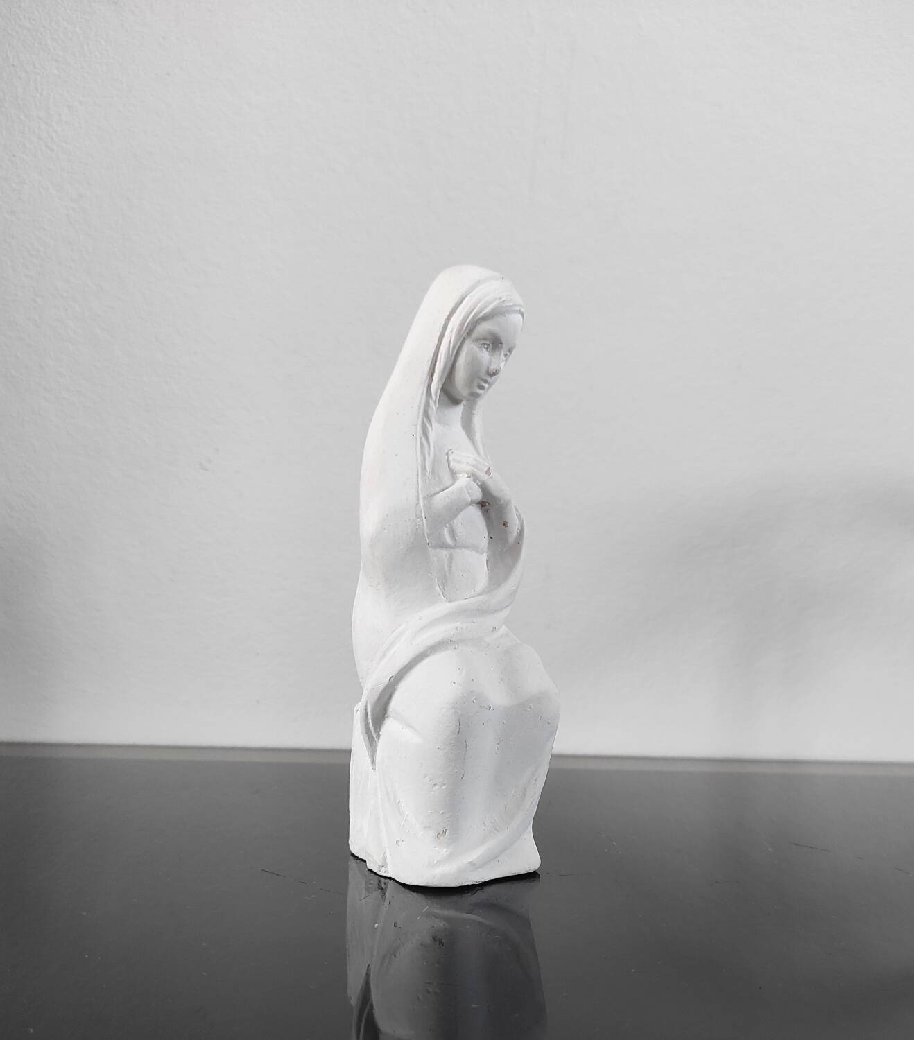 Vintage white plaster statuette of the Virgin Mary.