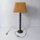 turned wooden lamp with spool base and vintage copper shade