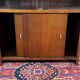 Small English oak library from the 1960s with sliding doors.