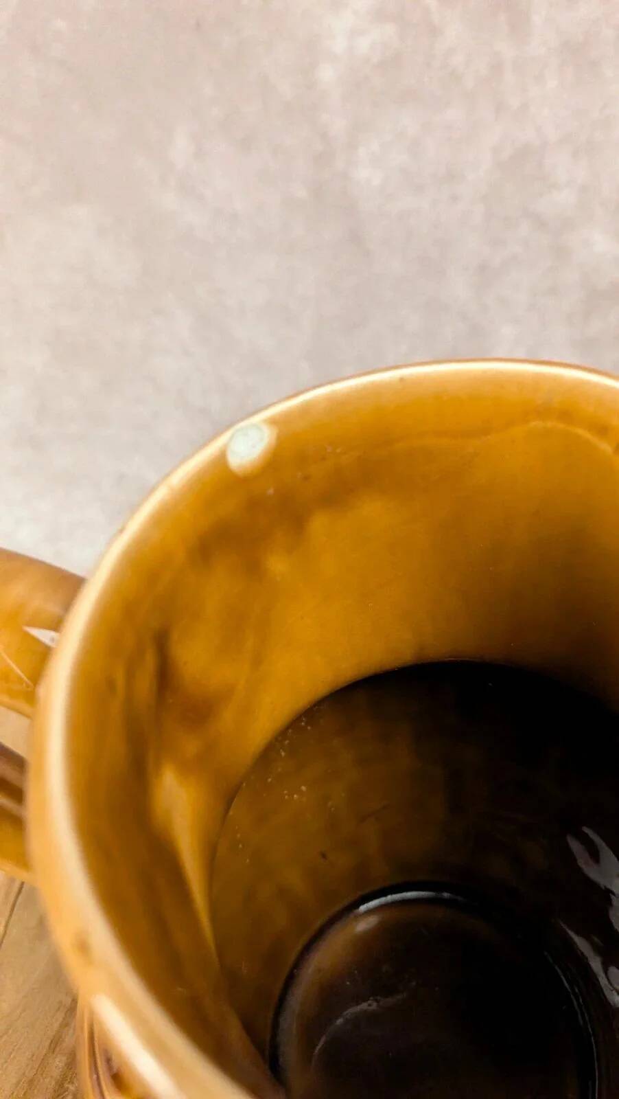 Vintage Sarreguemines pitcher with brown relief decoration.