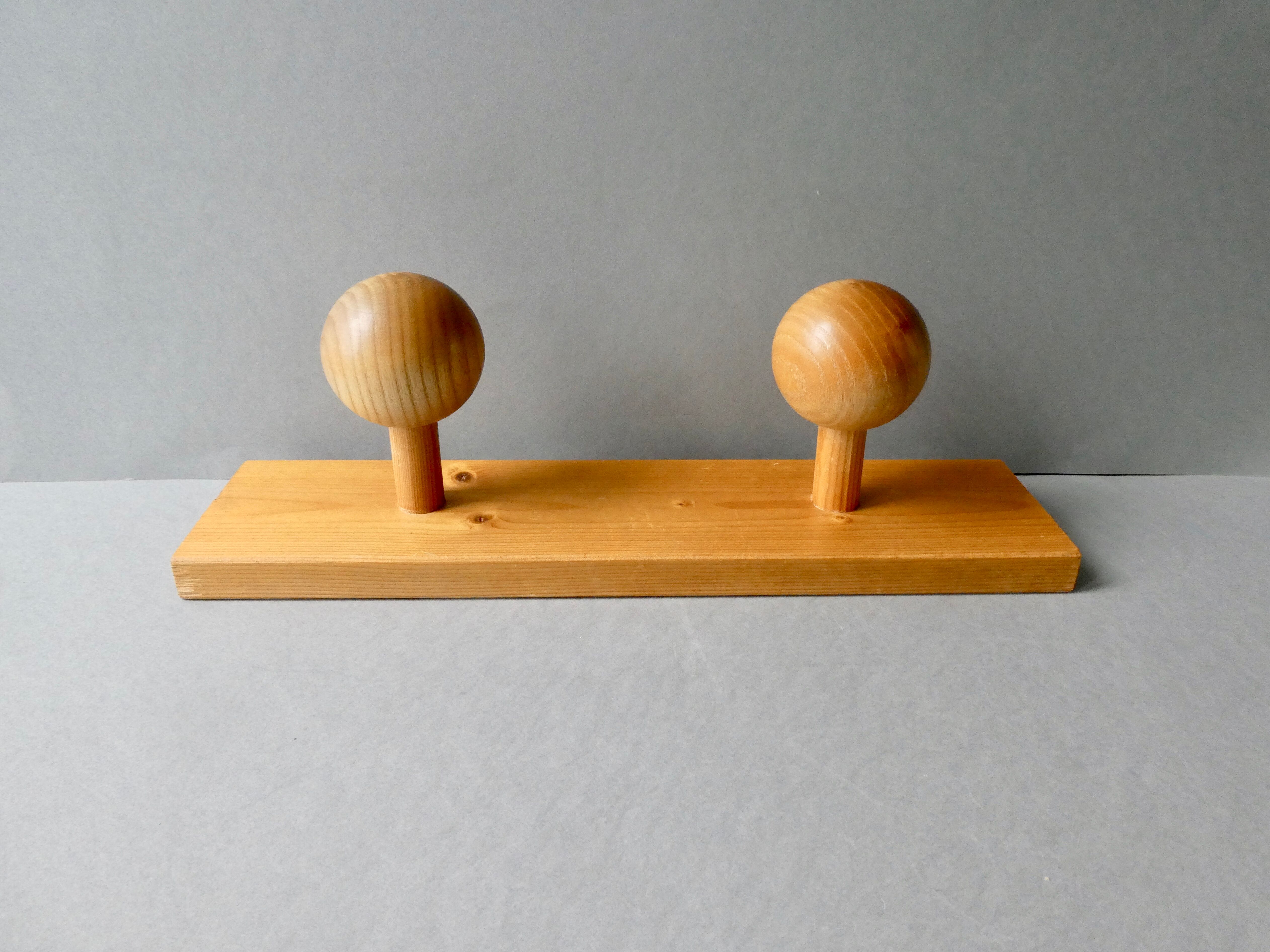 Wall coat rack with 2 pine ball hooks
