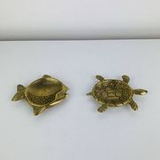 Pair of animal trinket trays in brass, fish and turtle.