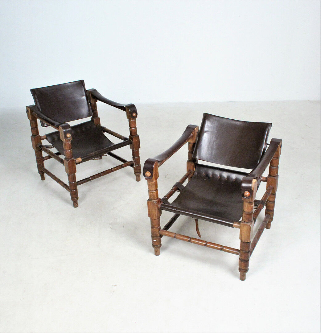 Pairs of vintage Safari style armchairs in wood and leather