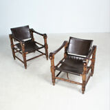 Pairs of vintage Safari style armchairs in wood and leather